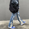Stylish men&#39;s fashion ensemble with blue baggy flare jeans, oversized zip hoodie, and big watches for everyday streetwear6