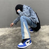 Stylish men&#39;s fashion ensemble with blue baggy flare jeans, oversized zip hoodie, and big watches for everyday streetwear2
