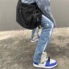 Stylish men&#39;s fashion ensemble with blue baggy flare jeans, oversized zip hoodie, and big watches for everyday streetwear0